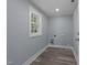 The laundry room features a window for natural light and updated hookups at 703 Whitsett Ave, Gibsonville, NC 27249