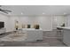 Spacious living room featuring modern decor, a ceiling fan, and hardwood floors at 703 Whitsett Ave, Gibsonville, NC 27249