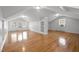 Spacious bonus room with hardwood floors and built-in shelves at 708 Parker St, Durham, NC 27701