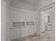 A dining room with built-in cabinets for storage and serving adjacent to the kitchen at 708 Parker St, Durham, NC 27701