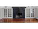 Classic brick fireplace with tile accents and built-in cabinets at 708 Parker St, Durham, NC 27701