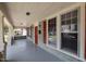 Inviting front porch features classic columns, red shutters, and ample natural light at 708 Parker St, Durham, NC 27701