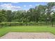 Fenced backyard with a stone patio backing up to a treed green space at 733 Daniel Ridge Rd, Wendell, NC 27591
