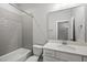 Clean bathroom featuring a shower-tub combo and vanity with a large mirror at 733 Daniel Ridge Rd, Wendell, NC 27591