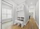 Bright foyer with coat rack, bench and view of the natural light coming through a window at 733 Daniel Ridge Rd, Wendell, NC 27591
