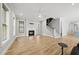 Bright living room boasts hardwood floors, fireplace, staircase, and neutral paint scheme at 733 Daniel Ridge Rd, Wendell, NC 27591