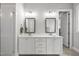 Main bathroom featuring double sinks, vanity, and neutral paint scheme at 733 Daniel Ridge Rd, Wendell, NC 27591