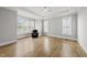 Spacious main bedroom featuring hardwood floors, a tray ceiling and ample natural light at 733 Daniel Ridge Rd, Wendell, NC 27591