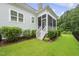 Beautiful screened-in porch with access to a well-maintained yard and landscaping at 733 Daniel Ridge Rd, Wendell, NC 27591
