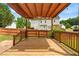 Well-maintained wooden deck with a pergola offering a shaded outdoor space for relaxation and entertainment at 741 Rockville Rd, Wake Forest, NC 27587