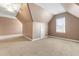 Spacious bedroom with angled ceilings, neutral carpet, and a window with plenty of natural light at 741 Rockville Rd, Wake Forest, NC 27587