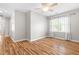 Bright bedroom with hardwood floors, a ceiling fan, and a window with natural light at 741 Rockville Rd, Wake Forest, NC 27587
