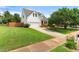 Beautiful home showcasing a spacious lawn, attached garage, and inviting front porch, perfect for suburban living at 741 Rockville Rd, Wake Forest, NC 27587