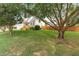 Traditional home featuring a well-manicured lawn and mature trees at 741 Rockville Rd, Wake Forest, NC 27587