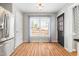 Bright kitchen with stainless steel refrigerator, black door, and a large window at 741 Rockville Rd, Wake Forest, NC 27587