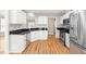 Spacious kitchen with granite counters, stainless steel appliances, and white cabinetry at 741 Rockville Rd, Wake Forest, NC 27587