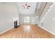 Bright and spacious living room featuring a cozy fireplace, vaulted ceilings, and an abundance of natural light at 741 Rockville Rd, Wake Forest, NC 27587