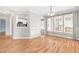 Spacious living room featuring an open floor plan and large windows with beautiful curtains at 741 Rockville Rd, Wake Forest, NC 27587