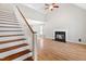 Spacious living room features hardwood floors, a cozy fireplace, and ample natural light, perfect for relaxation at 741 Rockville Rd, Wake Forest, NC 27587
