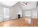 Inviting living room featuring a cozy fireplace, vaulted ceilings, and abundant natural light, ideal for relaxation at 741 Rockville Rd, Wake Forest, NC 27587