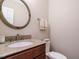 Powder room featuring granite counters and a wood vanity at 8504 Carlton Oaks Dr, Wake Forest, NC 27587