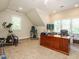 Open bonus room with office space and fitness equipment at 8504 Carlton Oaks Dr, Wake Forest, NC 27587