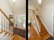 Bright foyer featuring hardwood floors and a staircase at 8504 Carlton Oaks Dr, Wake Forest, NC 27587