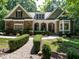 Charming stone and shake home with manicured landscaping and inviting front porch at 8504 Carlton Oaks Dr, Wake Forest, NC 27587