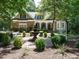 Beautiful home featuring a fountain and garden in the front yard at 8504 Carlton Oaks Dr, Wake Forest, NC 27587