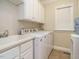 Laundry room featuring a washing machine, dryer, and sink at 8504 Carlton Oaks Dr, Wake Forest, NC 27587