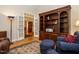 Comfortable living room with dark armchairs, area rug, and doorway to other rooms at 8504 Carlton Oaks Dr, Wake Forest, NC 27587