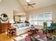 Bright living room filled with natural light, hardwood floors, and skylight at 8504 Carlton Oaks Dr, Wake Forest, NC 27587