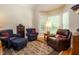 Cozy living room with armchairs, a patterned rug, and natural light at 8504 Carlton Oaks Dr, Wake Forest, NC 27587