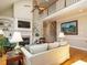 Cozy living room with fireplace, built-in shelving, vaulted ceiling, and hardwood floors at 8504 Carlton Oaks Dr, Wake Forest, NC 27587