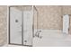 Modern bathroom with a separate shower and soaking tub at 8851 Mariner Dr, Raleigh, NC 27615