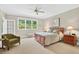 Inviting bedroom with bright windows and a cozy sitting area at 8851 Mariner Dr, Raleigh, NC 27615