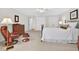 Spacious bedroom features hardwood floors, white walls and trim, and stylish furnishings at 8851 Mariner Dr, Raleigh, NC 27615
