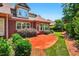 Charming brick home with a brick patio and lush landscaping, perfect for outdoor living at 8851 Mariner Dr, Raleigh, NC 27615