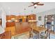 Eat-in kitchen features wood cabinets, granite countertops, and a breakfast table with seating at 8851 Mariner Dr, Raleigh, NC 27615