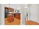 Kitchen with wood cabinets, granite countertops, stainless steel appliances, and hardwood floors at 8851 Mariner Dr, Raleigh, NC 27615