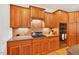 This kitchen boasts stainless steel appliances, granite countertops, and custom wood cabinets at 8851 Mariner Dr, Raleigh, NC 27615