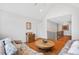Cozy living room with hardwood floors and a staircase in the background at 8851 Mariner Dr, Raleigh, NC 27615