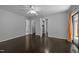 Bright and spacious bedroom features dark wood floors, ceiling fan, and en suite bathroom and closet at 9709 Greenfield Rd, Chapel Hill, NC 27516