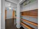 Hallway leading to bedroom with a closet with wooden shelving, plus overhead art at 9709 Greenfield Rd, Chapel Hill, NC 27516