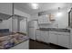 Bright kitchen with white cabinets, modern appliances, and stunning blue granite countertops at 9709 Greenfield Rd, Chapel Hill, NC 27516