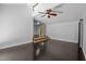 Bright living room with vaulted ceilings, dark hardwood floors, and a ceiling fan at 9709 Greenfield Rd, Chapel Hill, NC 27516