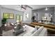Virtually staged living room with hardwood floors, vaulted ceilings, and modern furnishings at 9709 Greenfield Rd, Chapel Hill, NC 27516