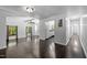 Spacious living room with hardwood floors and multiple entryways, offering a versatile layout at 9709 Greenfield Rd, Chapel Hill, NC 27516
