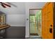 The front door opens up into a living room with wood floors and white walls at 9709 Greenfield Rd, Chapel Hill, NC 27516