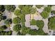 Aerial view of an apartment complex surrounded by lush trees and multiple parking spaces at 1010 Nicholwood Dr # 301, Raleigh, NC 27605